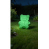 Figura de cemento oso pequeño efecto fosforescente verde, que se ilumina en la oscuridad