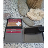 Cartera de piel legitima, negra abierta con compartimentos para tarjetas y sello artesano de lisviv