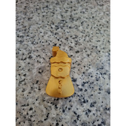 Detalle en primer plano de los tres botones en relieve y silueta alargada de Papá Noel de cemento oro.