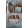 Composición bolso tote de autor en piel marfil con diseño patchwork en cuatro cuadrantes, detalles metalizados interior forrado.