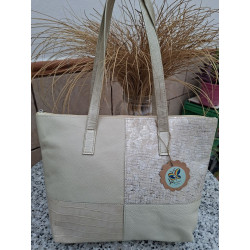 Vista frente bolso hombro tipo tote piel marfil diseño cuatro cuadrantes combinados texturas grabadas cocodrilo y plateados