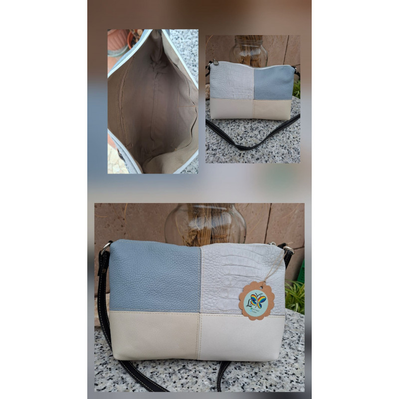 Composición bolso bandolera de autor piel diseño patchwork tonos azul cielo beige y blanco texturas grabadas e interior forrado.