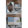 Composición bolso bandolera de autor piel diseño patchwork tonos azul cielo beige y blanco texturas grabadas e interior forrado.