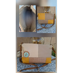 Composición bolso bandolera de autor piel diseño patchwork tonos mostaza, beige y marrón claro texturas cocodrilo.